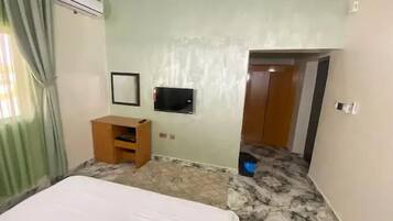 Family Apartment, Balcony, City View | In-room safe, desk, laptop workspace, blackout drapes