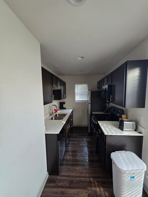 Fridge, microwave, oven, stovetop - Regan 207: Modern Living Redefined (Dallas)