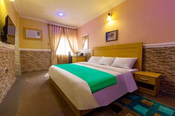 Deluxe Room, Balcony, City View | Desk, laptop workspace, blackout drapes, soundproofing