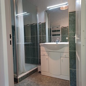 Shower, hair dryer, towels, soap