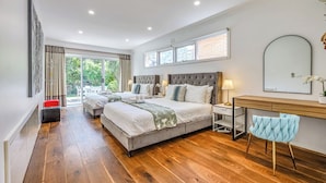 A bedroom with two beds, a desk, a chair, and a large window. - StayAU Pet-Friendly 4BR Retreat in Balwyn North (Balwyn North)
