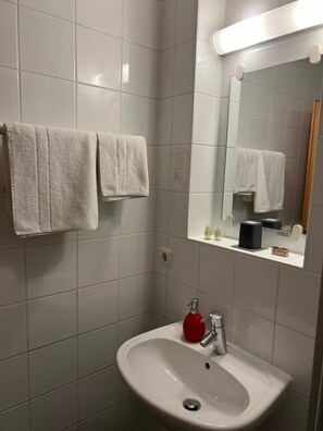 Shower, free toiletries, towels, soap