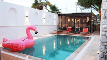 Seasonal outdoor pool, pool umbrellas, pool loungers