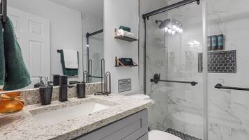 Shower, hair dryer, towels, soap