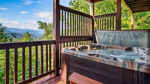 A hot tub in a wooden gazebo with a scenic mountain view. - Spacious Lodge w/ Scenic Views & Resort Amenities (Gatlinburg)