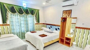 A hotel room with a bed, a bedside table, a wardrobe, and a mirror. - Moro Rasdhoo (Rasdhoo)