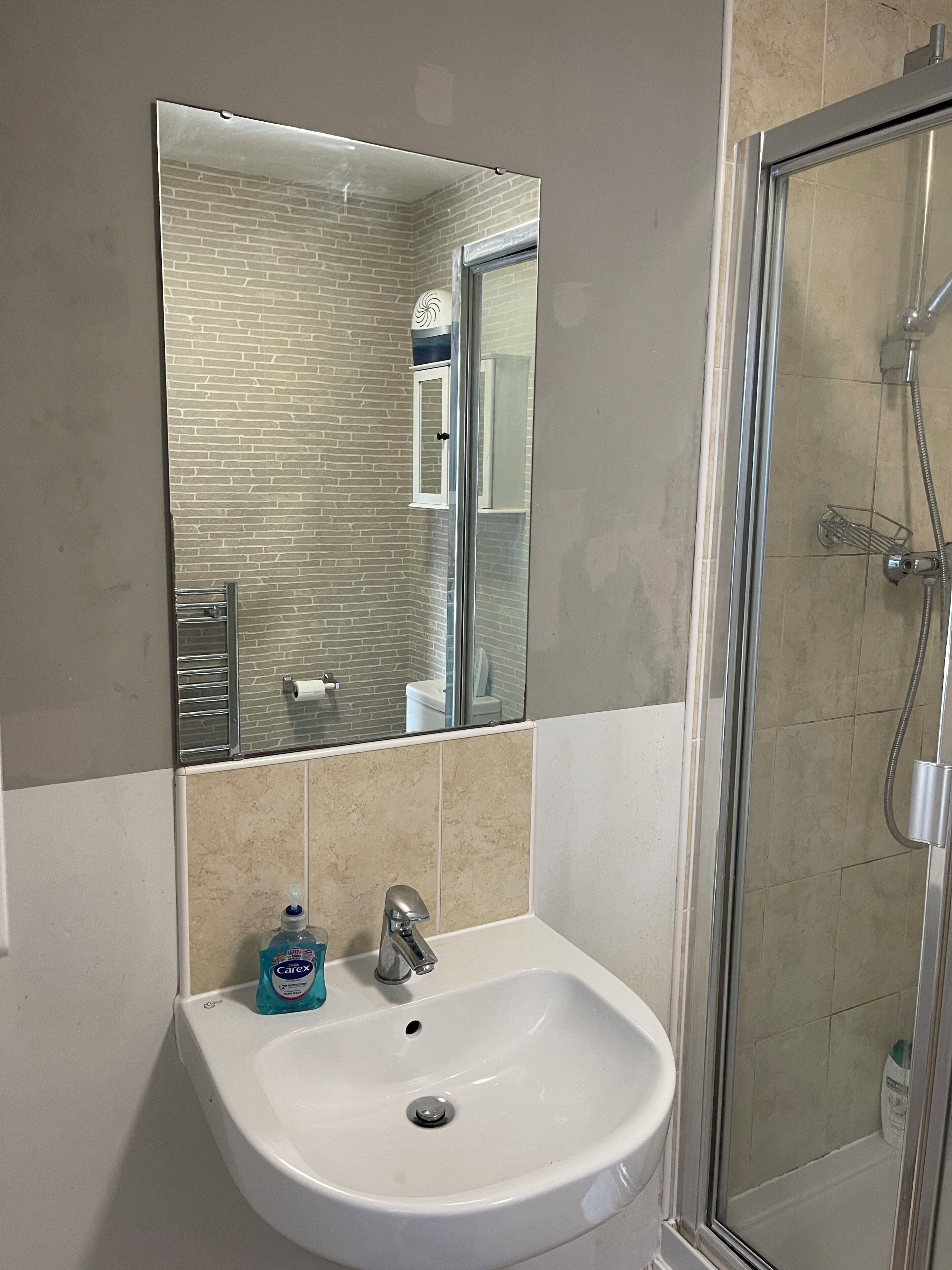 Shower, towels, soap, toilet paper