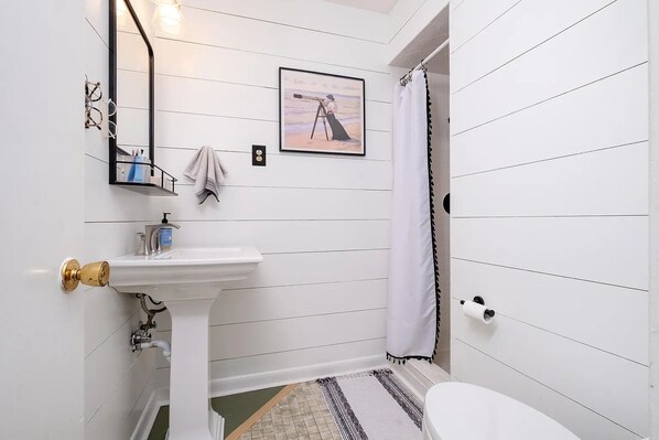 Shower, towels, soap, toilet paper