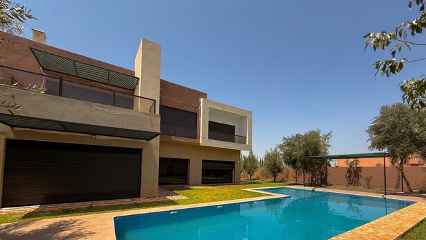 A modern two-story house with a swimming pool, a covered patio, and a garage.