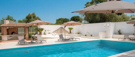 Outdoor pool, pool umbrellas, pool loungers