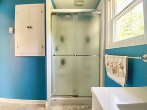 Shower, hair dryer, towels, soap