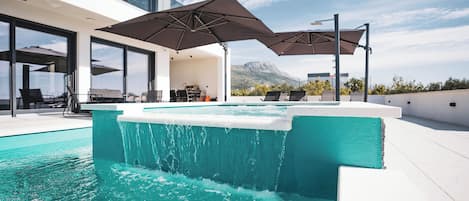 Outdoor pool, pool umbrellas, pool loungers