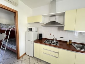 Fridge, microwave, stovetop, cookware/dishes/utensils