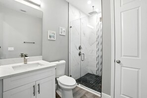 Shower, hair dryer, towels, soap