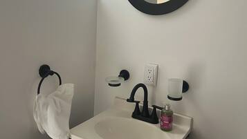 Shower, towels, soap, toilet paper