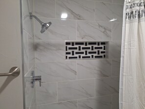 Shower, hair dryer, towels, toilet paper