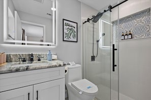 Shower, hair dryer, towels, soap