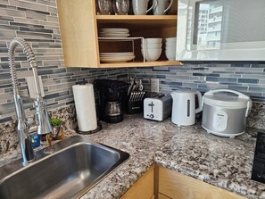 Fridge, microwave, stovetop, coffee/tea maker