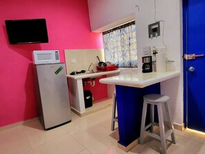 Fridge, microwave, stovetop, coffee/tea maker