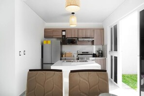 Fridge, microwave, stovetop, coffee/tea maker