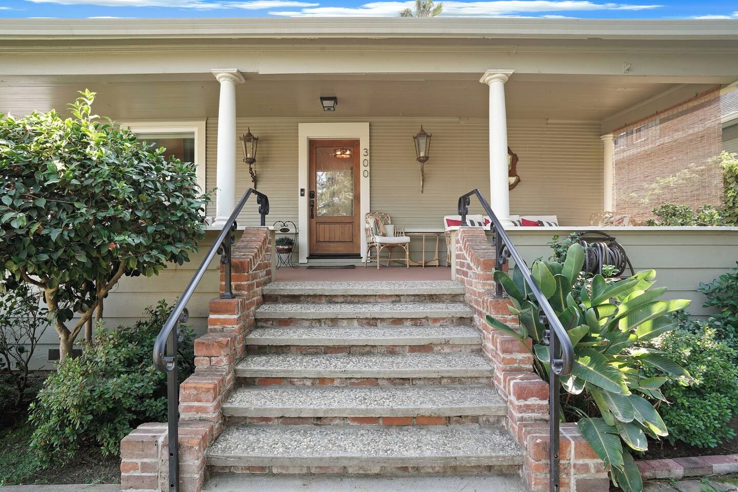 Front entry with brick steps and covered porch