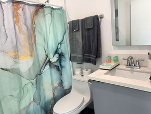 Hair dryer, towels, soap, shampoo