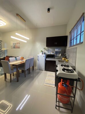 Fridge, microwave, stovetop, coffee/tea maker