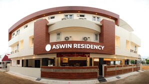 A modern building with a curved facade, labeled "ASWIN RESIDENCY". - Aswin Residency (Namakkal)