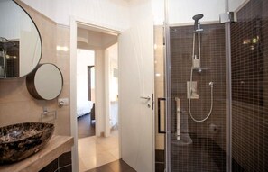 Shower, free toiletries, hair dryer, slippers