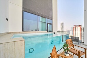Pool - Modern 2BR Retreat in JVC w/ Private Pool Balcony (Dubai)