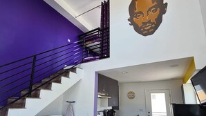 A modern kitchen with a built-in oven and a dining area with a purple tablecloth. - Kobe Bryant vacation getaway - 5 minutes to Rodeo Drive, Game console, Hot Tub (Beverly Hills)