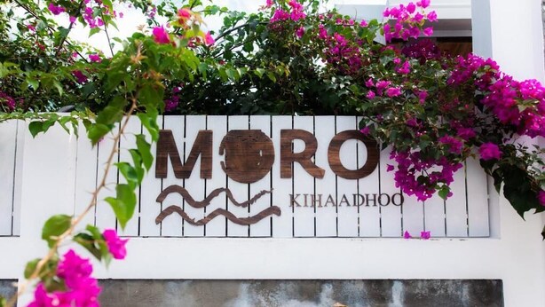 A white wall with the text "MORO KIHAADHOO" and a logo. - Moro Kihaadhoo (Kihaadhoo)