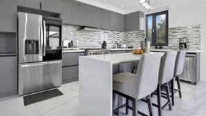 Coffee/tea maker, fridge, microwave, oven