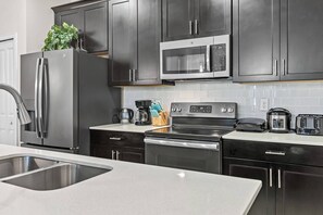 Microwave, stovetop, dishwasher, coffee/tea maker