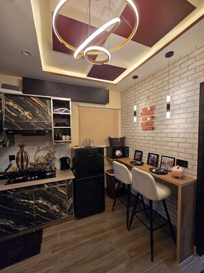 Microwave, stovetop - Shahzaib's Home 1BHK Modern Apartment at City Center (Lahore)