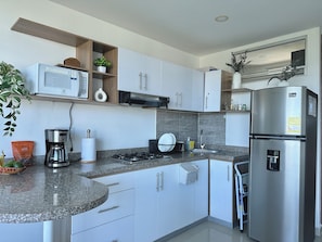 Fridge, microwave, coffee/tea maker, coffee grinder