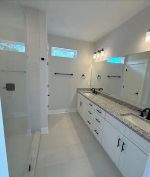 Shower, hair dryer, towels, toilet paper