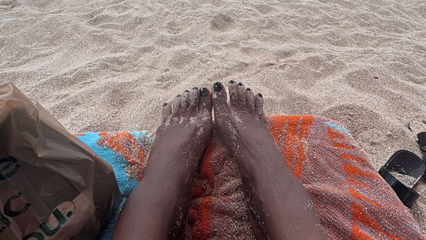 A beach scene with a towel and a bag on the sand. - All Inclusive Hotel- Montego Bay, Jamaica (Montego Bay)