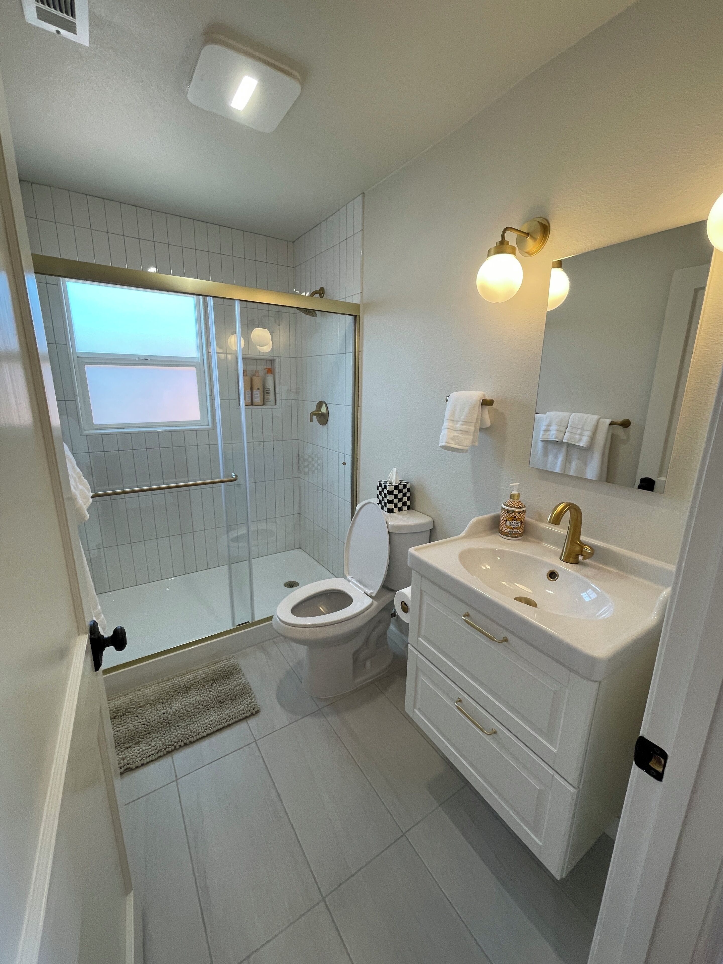 Shower, hair dryer, towels, soap
