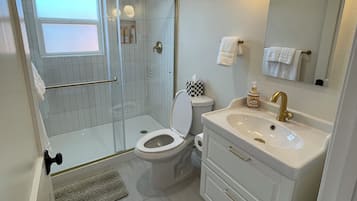 Shower, hair dryer, towels, soap