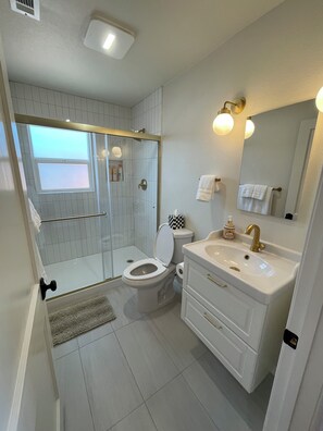 Shower, hair dryer, towels, soap
