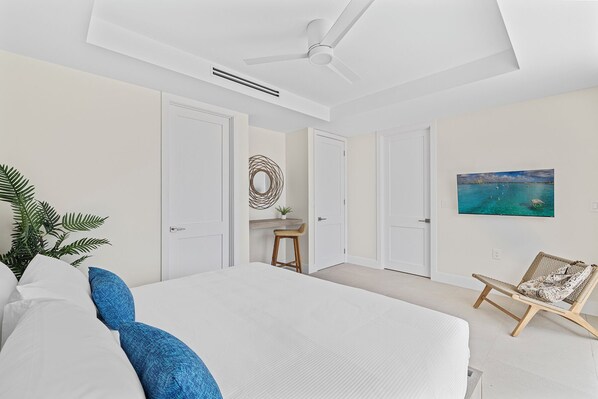 Family Townhome, Pool View | In-room safe, desk, laptop workspace, iron/ironing board