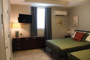 1 bedroom, desk, iron/ironing board, travel crib