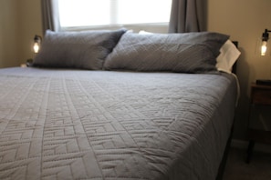 1 bedroom, desk, iron/ironing board, travel crib