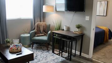 1 bedroom, desk, iron/ironing board, travel crib