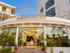 A hotel entrance with a sign reading 'THE ELEGANCE'. - The Elegance Resort (Chittorgarh)