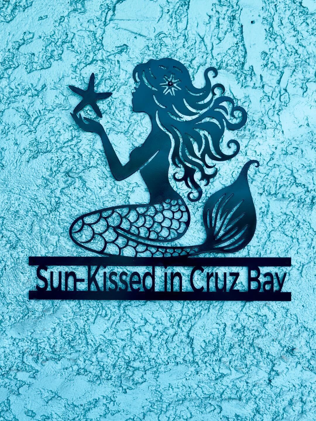 A mermaid logo with the text "Sun-Kissed in Cruz Bay".