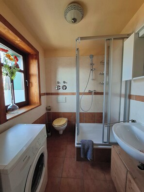 Shower, hair dryer, towels, soap