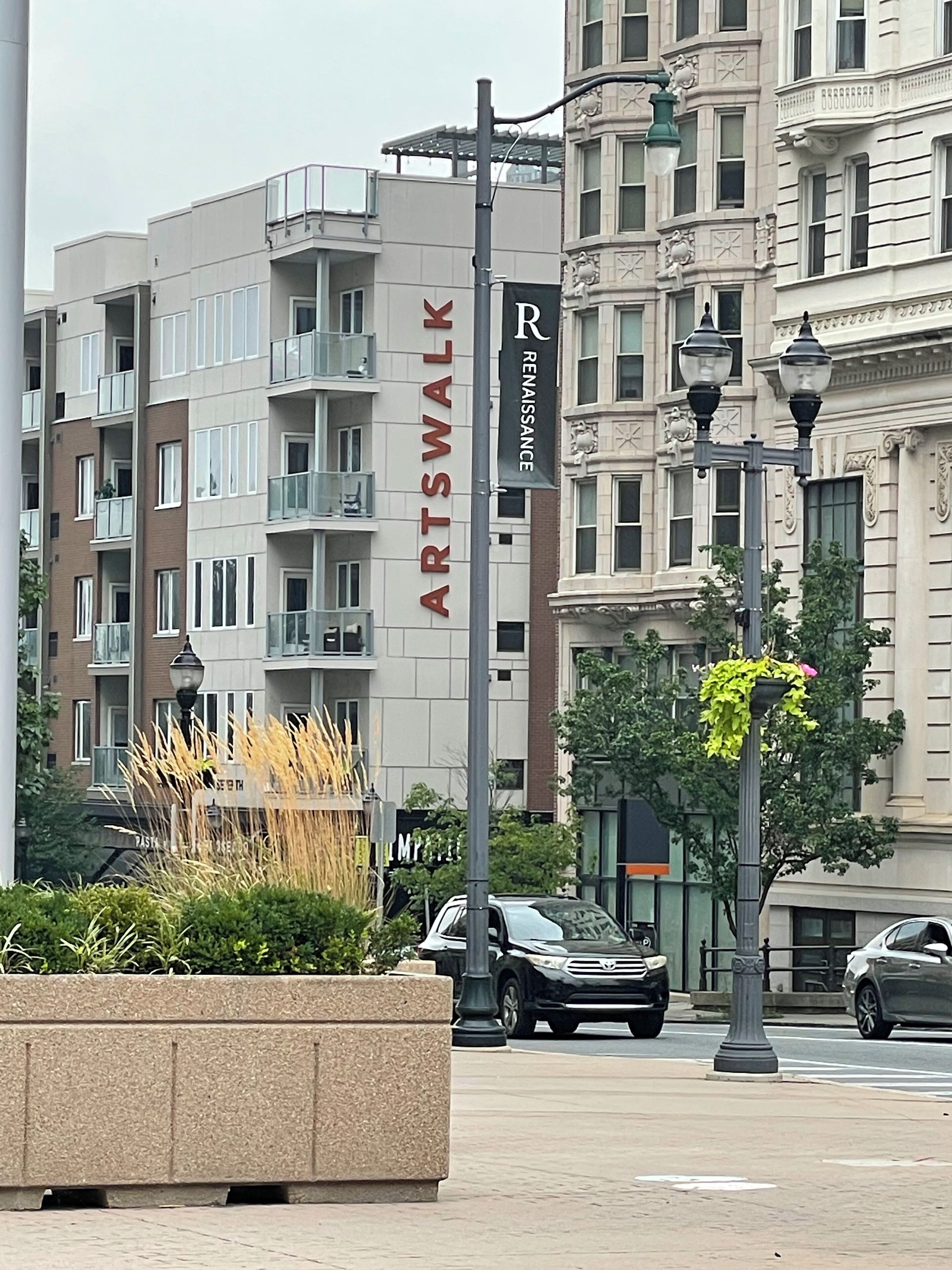 A multi-story building with a sign reading "ARTSWALK" and a "Renaissance" banner.