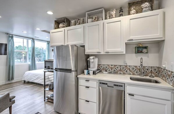 Fridge, microwave, stovetop, coffee/tea maker